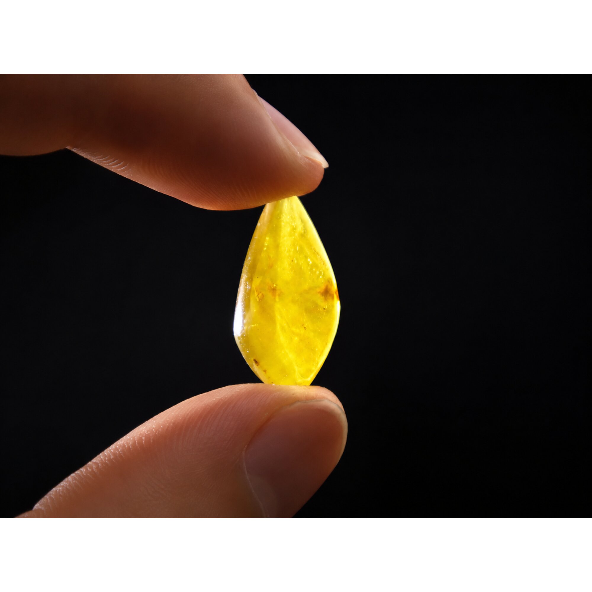 Translucent eggyolk yellow Natural Dominican Amber teardrop Polished Stone 26 mm – photo 3