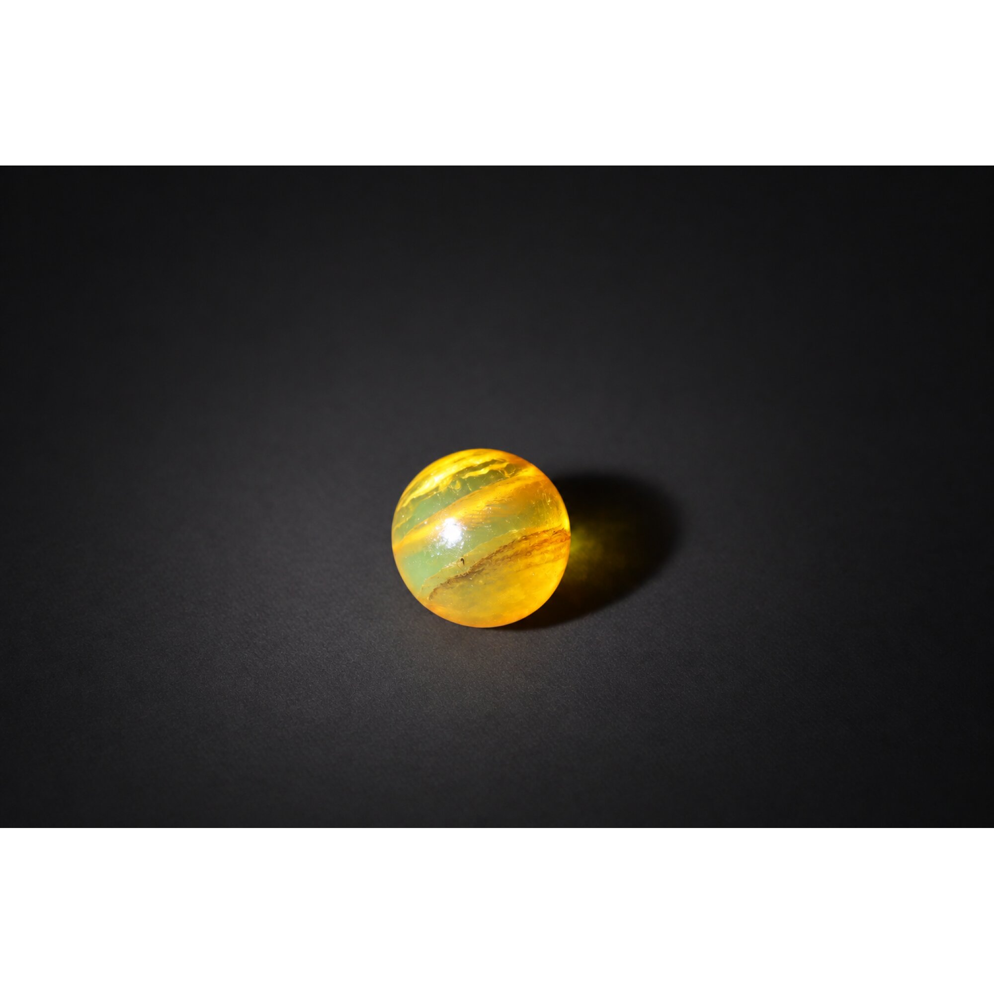 Pure natural orange green Dominican amber sphere/ball 20.5mm – photo 4