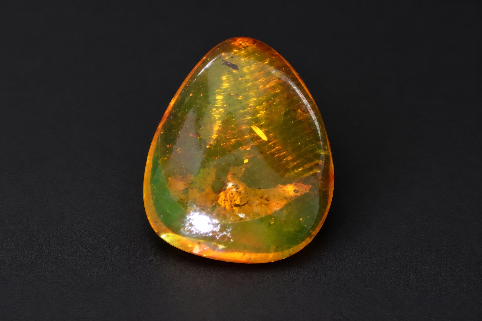 Authentic orange green Dominican amber cabochon – photo 4
