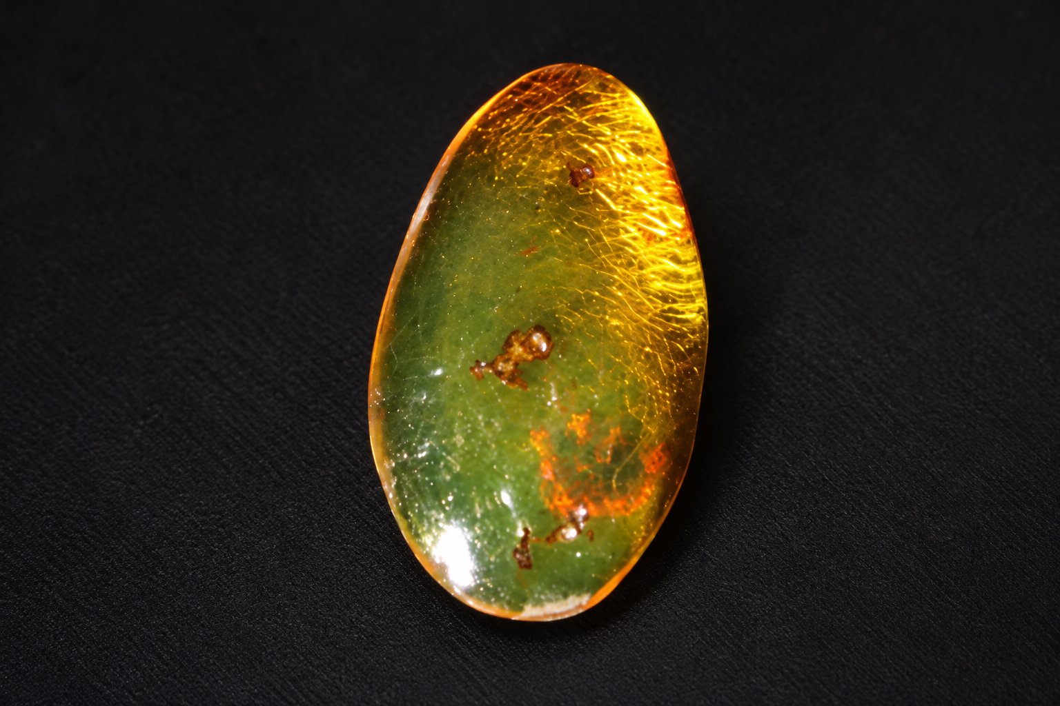 Authentic deep green Dominican amber cabochon – photo 7
